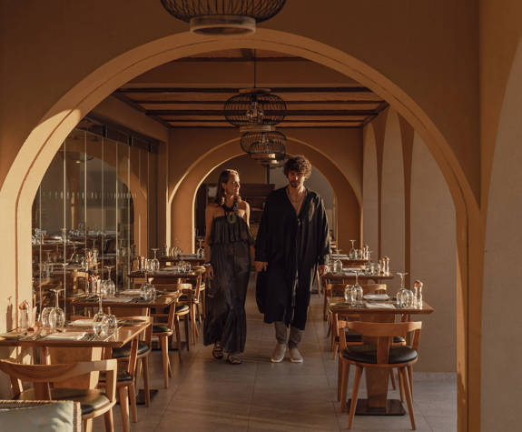 Minos Ambassador Elia Restaurant Couple Walking Between the Tables 