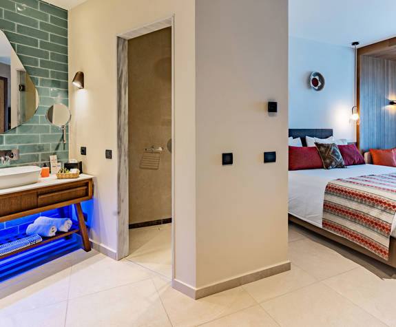 Minos Ambassador Superior Junior Suite Bathroom Entrance and Bedroom