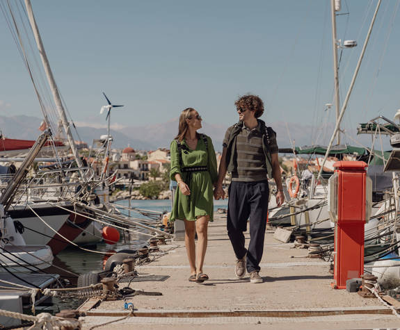 Couple Enjoying a Walk at the Port