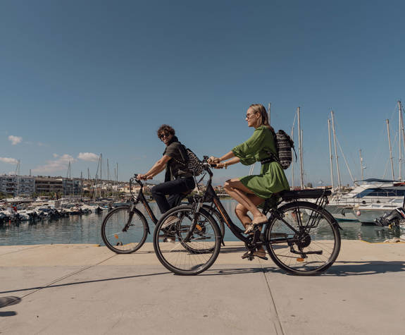 Couple Enjoying a Bike Ride at the Port