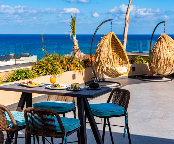 Minos Ambassador Thalassa Pool Bar Table Outside Served with Fruits and English Breakfast