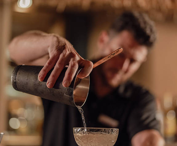 Minos Ambassador Thalassa Pool Bar Restaurant Bartender Serving A Cocktail