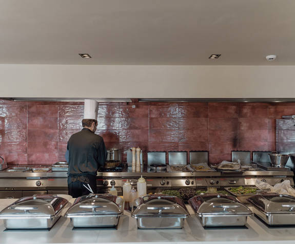 Minos Ambassador Cook Preparing the Buffet in Elia Restaurant