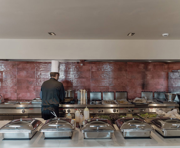 Minos Ambassador Cook Preparing the Buffet in Elia Restaurant