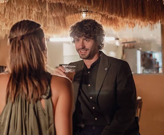 Minos Ambassador Thalassa Pool Bar Restaurant Couple enjoying their Drinks at the Bar