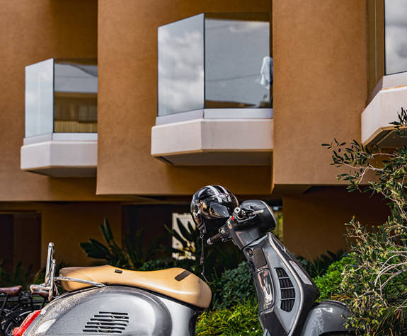 Motorcycle Parked By The Hotels Side