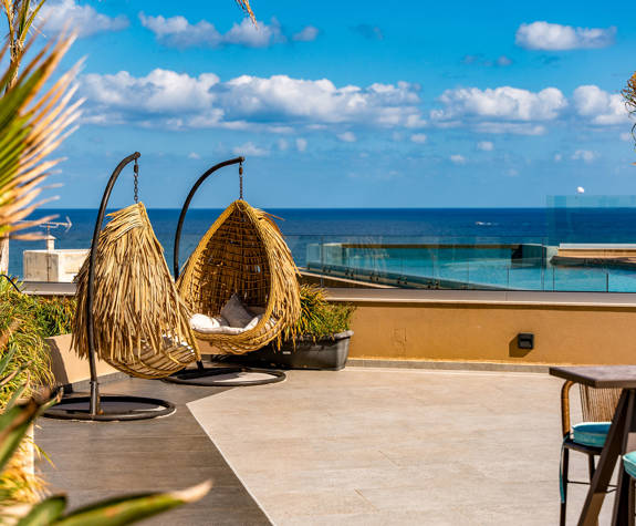 Comfortable Hanging Egg Chairs at The Rooftop Area