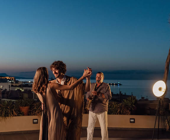 Couple Enjoying Dancing to the Sounds of Saxophone