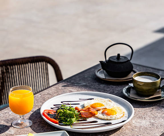 Minos Ambassador Thalassa Pool Bar Table Outside Served with Fruits and English Breakfast