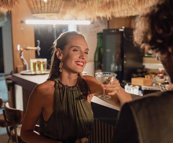 Minos Ambassador Thalassa Pool Bar Restaurant Couple enjoying their Drinks at the Bar