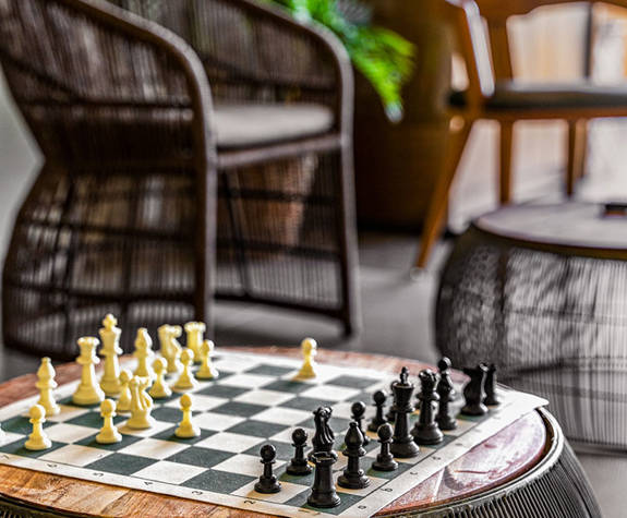 A Chess Game at a Modern Table of the Hotel