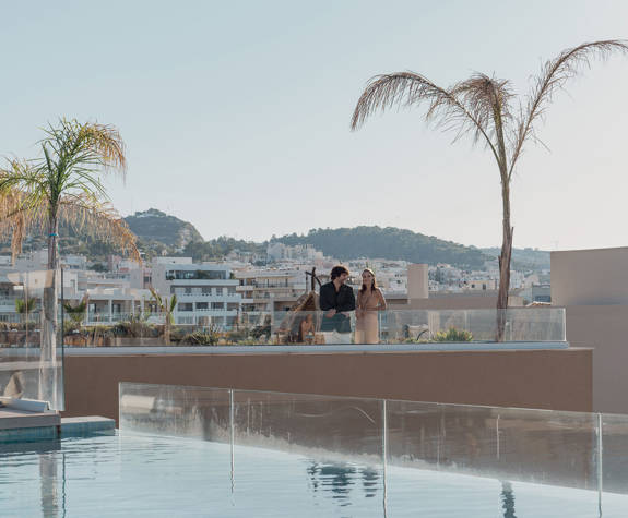A Couple Enjoying the View From the Rooftop