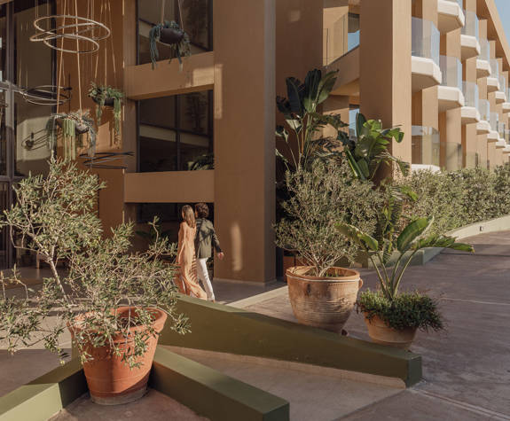 A Wide View of A Couple Heading to the Entrance of the Reception