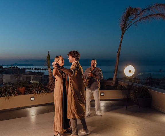 Couple Enjoying Dancing to the Sounds of Saxophone